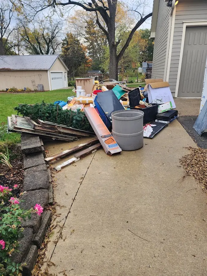 Dumpster being loaded with debris for Residential Dumpster Rental in Goodview